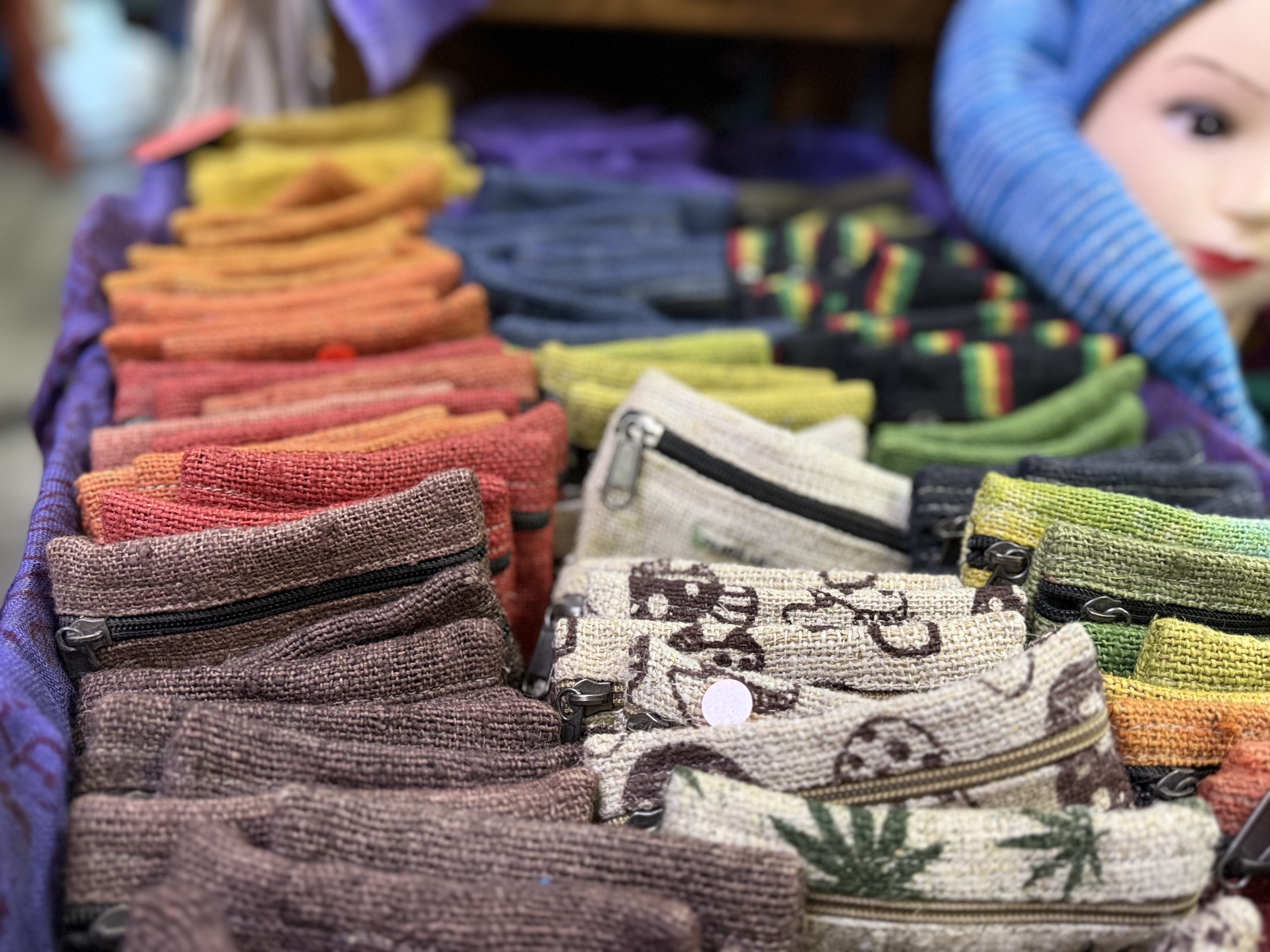 Colourful skirts, tie-dye rails and hippie clothing